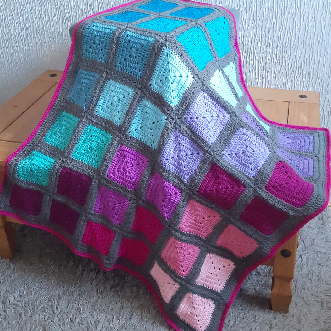 Bright pink, purple, blue and grey granny square baby/lap blanket