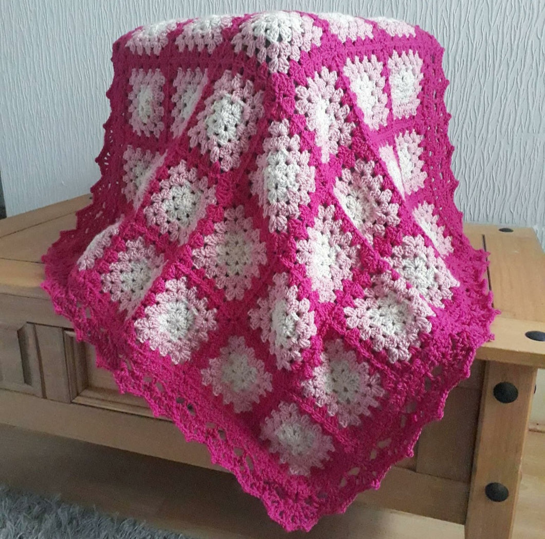 Bright pink granny square crochet baby/lap blanket